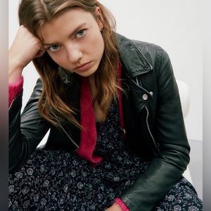 Classic Madewell leather jacket with metal zipper and snap buttons.